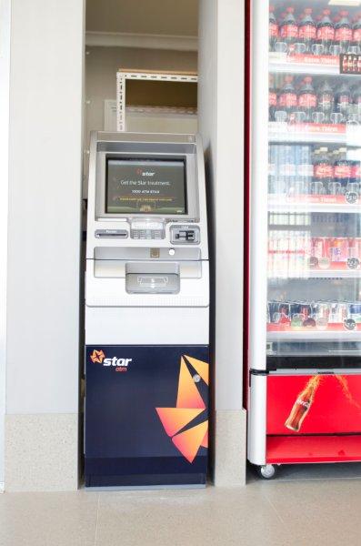 atm next to vending machine front view
